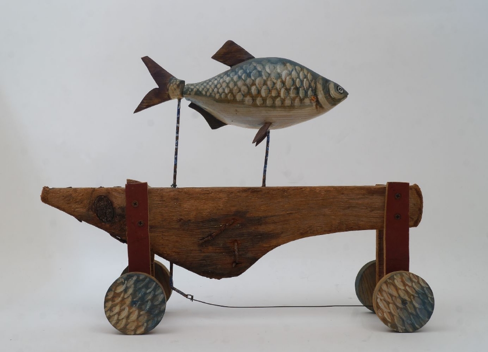 British School, 20th century- Fish; painted carved wood and metal on wooden wheels, 31 x 41 x