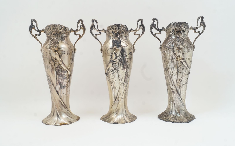 Three WMF Art Nouveau figural pewter vases, 20th century, lacking glass liners, designed with a