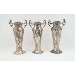 Three WMF Art Nouveau figural pewter vases, 20th century, lacking glass liners, designed with a