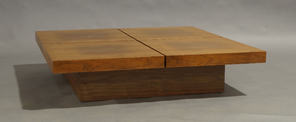 A Contemporary walnut veneered low coffee table, with sliding mechanism enclosing storage