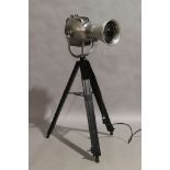 A modern chrome floor lamp, in the form of a vintage theatre spot light, marked 'Strand Electric',