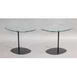 A pair of contemporary side tables, of recent manufacture, with rounded rectangular glass tops on