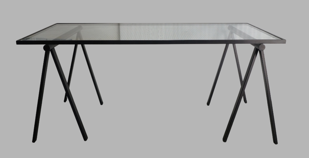 A Rodney Kinsman trestle table, black steel supports and glass top, 74cm high, 168cm wide, 76cm