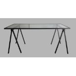 A Rodney Kinsman trestle table, black steel supports and glass top, 74cm high, 168cm wide, 76cm