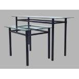 A black steel console table with glass top, 67cm high, 127cm wide, 45cm deep, together with matching