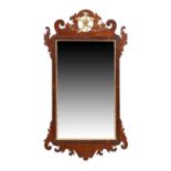 A George III walnut fret work pier mirror, c.1770, the carved crest with gilt hoho bird, set with...