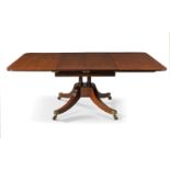 A Regency mahogany extending dining table, by Thomas Butler, c.1820, the rounded rectangular top ...