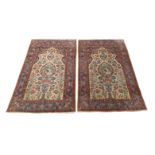 A pair of Persian Sarouk rugs, third quarter 20th century, the central field with vase of flowers...