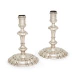 A pair of George II cast silver candlesticks, London 1743, maker's mark T G, possibly Thomas Gilp...