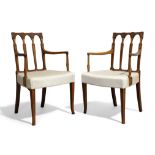 A pair of George III mahogany and satinwood inlaid elbow chairs
