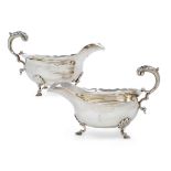 A pair of George III silver sauceboats, London 1797 and 1798, Peter & Ann Bateman, both raised on...