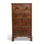 A Victorian mahogany pedestal chest, c.1850, the four graduated drawers with turned handles inset...