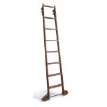 An oak rolling library ladder