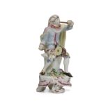 A Bow porcelain Commedia dell'arte figure of a drummer, c.1760, probably Mezzetin, modelled seate...