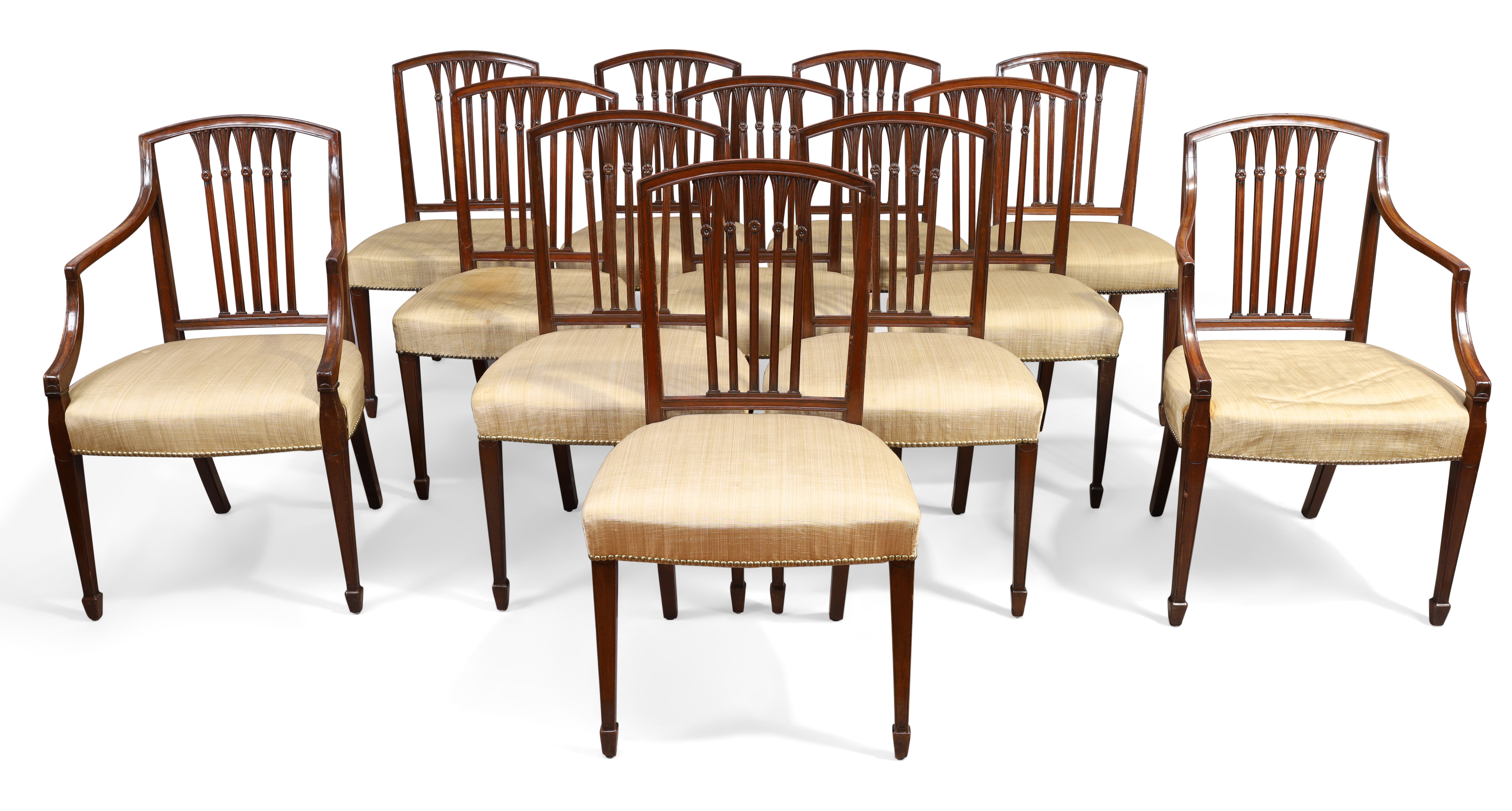 A set of twelve George III Hepplewhite style mahogany dining chairs