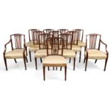 A set of twelve George III Hepplewhite style mahogany dining chairs