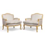 A pair of French Louis XV style oversized painted beech wood armchairs