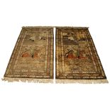 A pair of Persian Kashan silk pictorial rugs