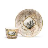 A Frankenthal porcelain marbled ground teacup and saucer, c.1783, blue crowned CT monogram and 83...