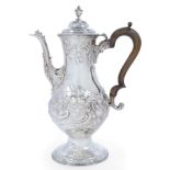 A George III silver coffee pot, London, 1783, John Kidder, of baluster form, the repousse floral ...