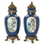 A pair of French Samson powder-blue ground famille verte jars and covers