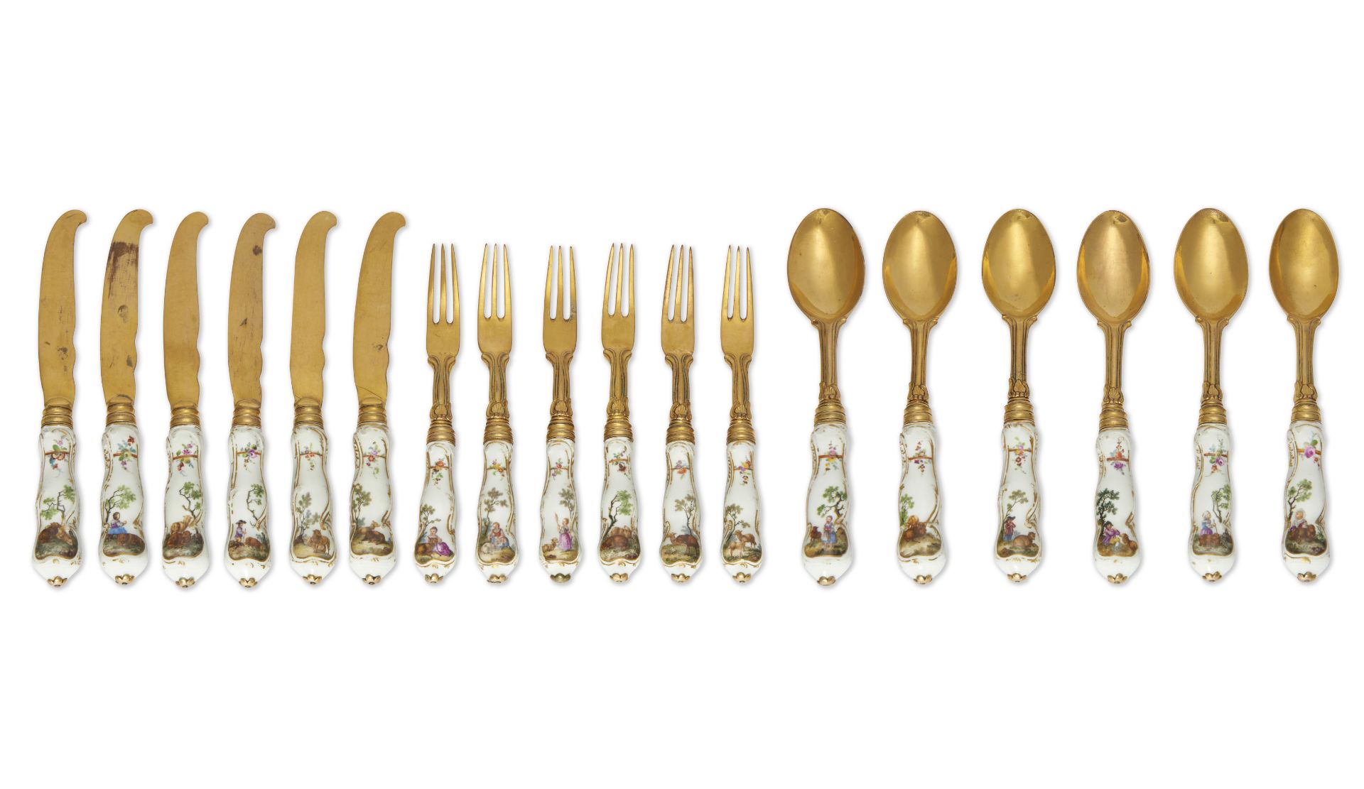 A set of Berlin (K.P.M.) porcelain silver-gilt mounted cutlery handles, c.1770, painted with shep...