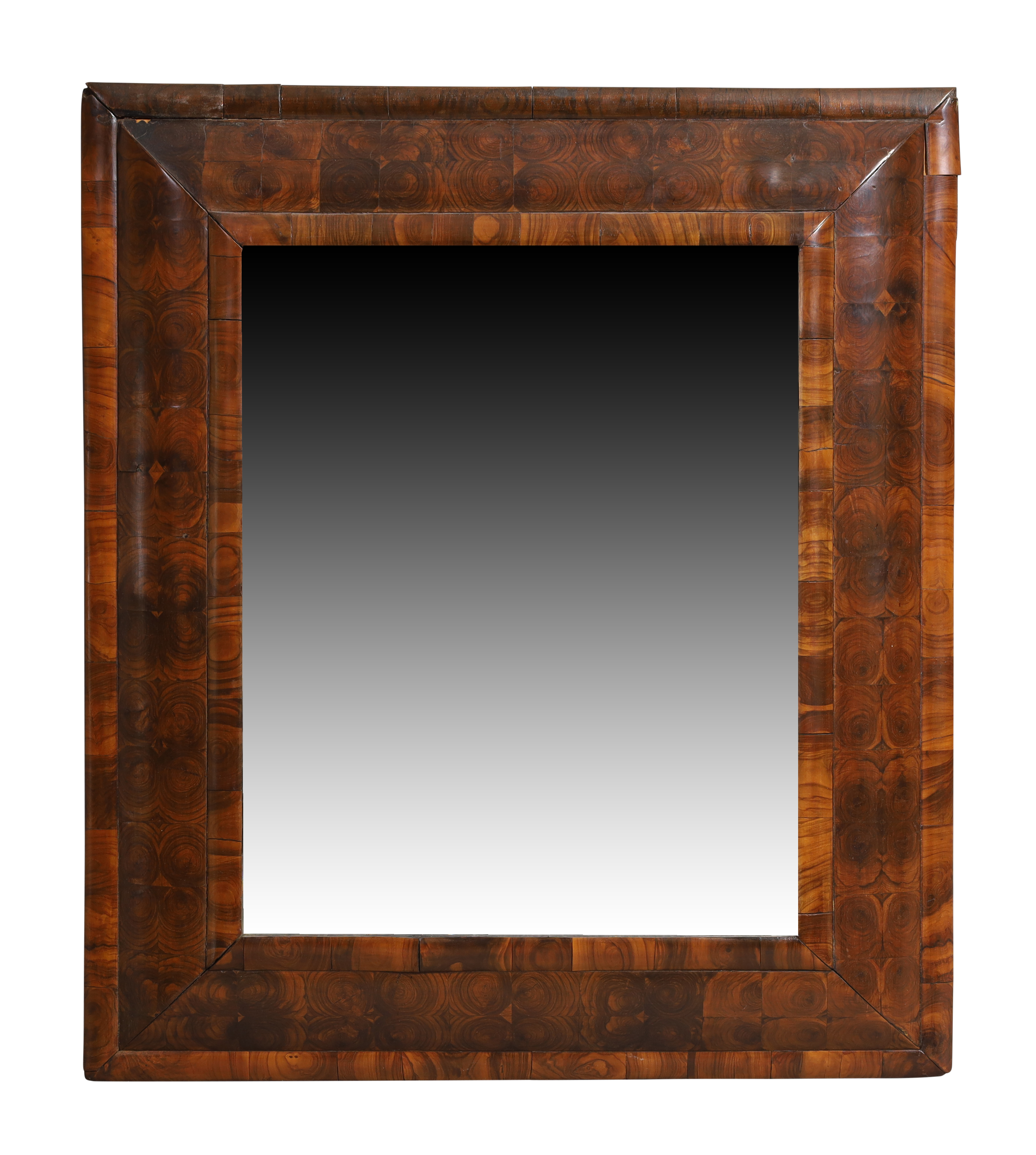 A William & Mary oyster veneered walnut cushion framed mirror, c.1700, the moulded framed with la...