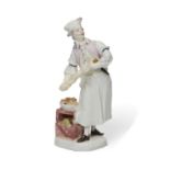 A Vienna porcelain figure of a Cavalier dressed as a cook, c.1755-60, blue shield mark, incised H...