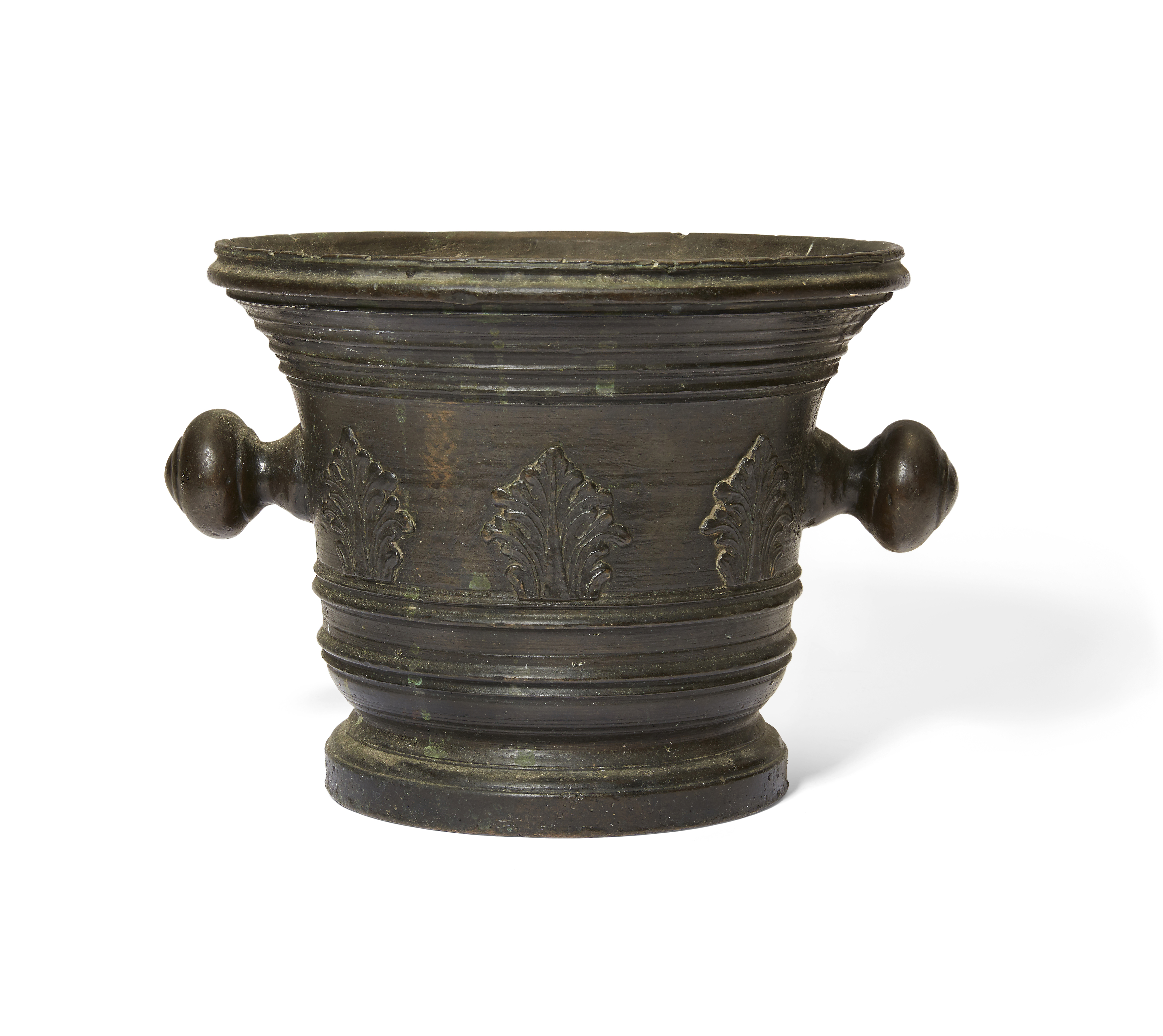 An Italian bronze mortar, late 17th century, the body cast with a band of acanthus leaves, with k...