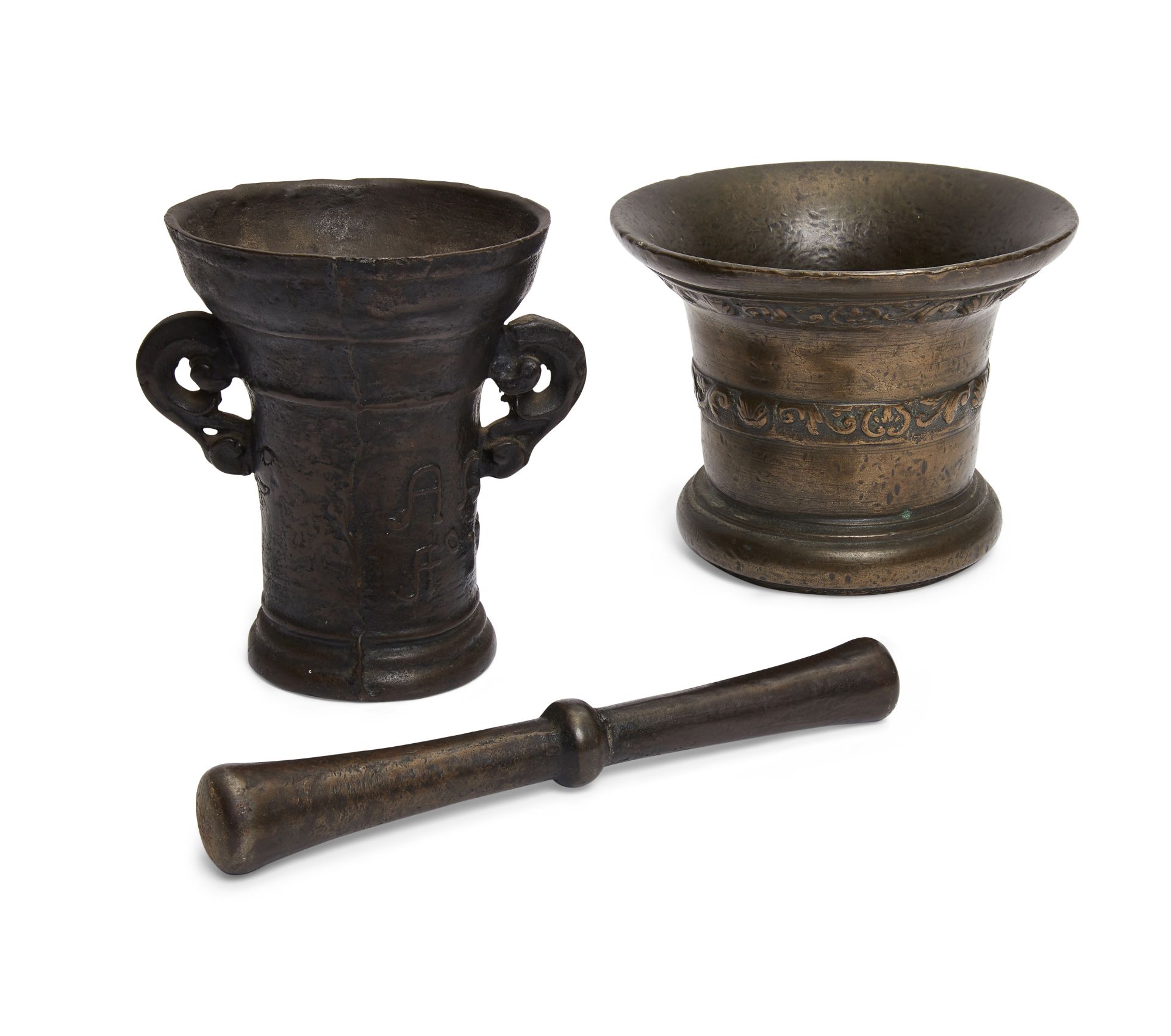 A Dutch/Flemish bronze mortar, 18th century, cast with two bands of scrolls and shells, 14cm high...
