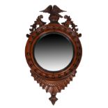 An early Victorian mahogany convex mirror