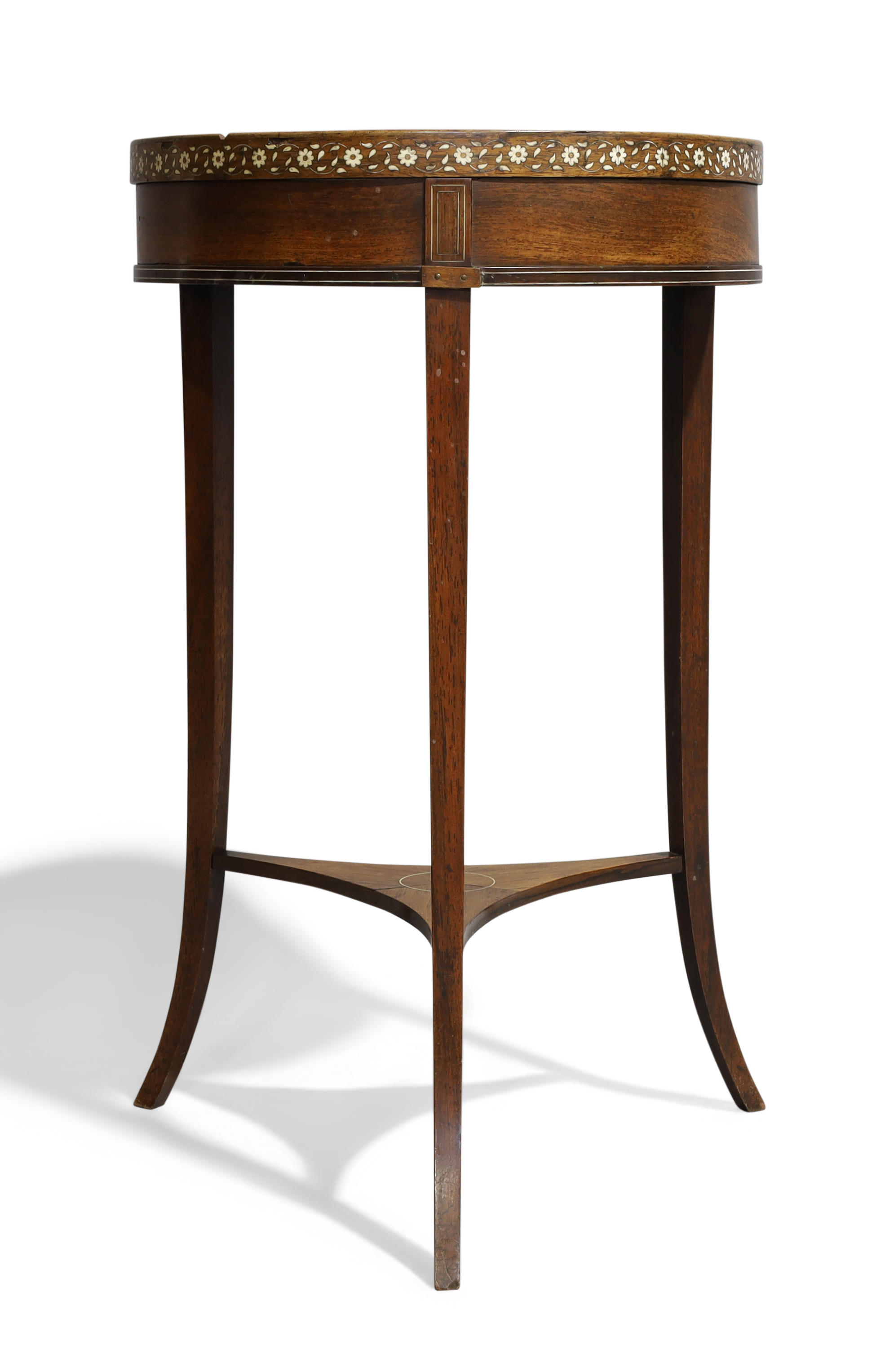 A Regency rosewood jardinière stand, c.1820, ivory inlaid, the circular top raised on square tape...