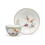 A Meissen porcelain celedon ground tea bowl and saucer, c.1735, blue crossed swords marks, wheel-...