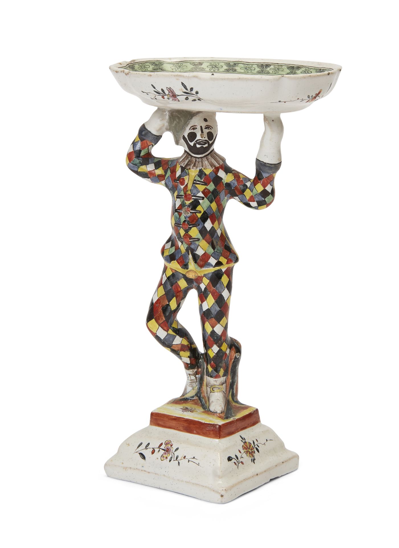 A Bayreuth fayence salt, mid-18th century, blue B·K mark, modelled with Harlequin from the Commed...