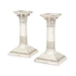 A pair of Victorian silver candlesticks, London, 1887, Edward Hutton, of short Corinthian columna...