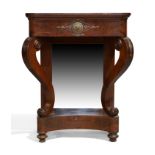 An Empire flame mahogany console table, c.1810, gilt metal mounted, with scrolling sabre supports...
