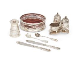 An Edwardian silver condiment set, London, 1903, Goldsmiths and Silversmiths Co., comprising two ...