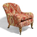 A Victorian light oak framed armchair by Gillows