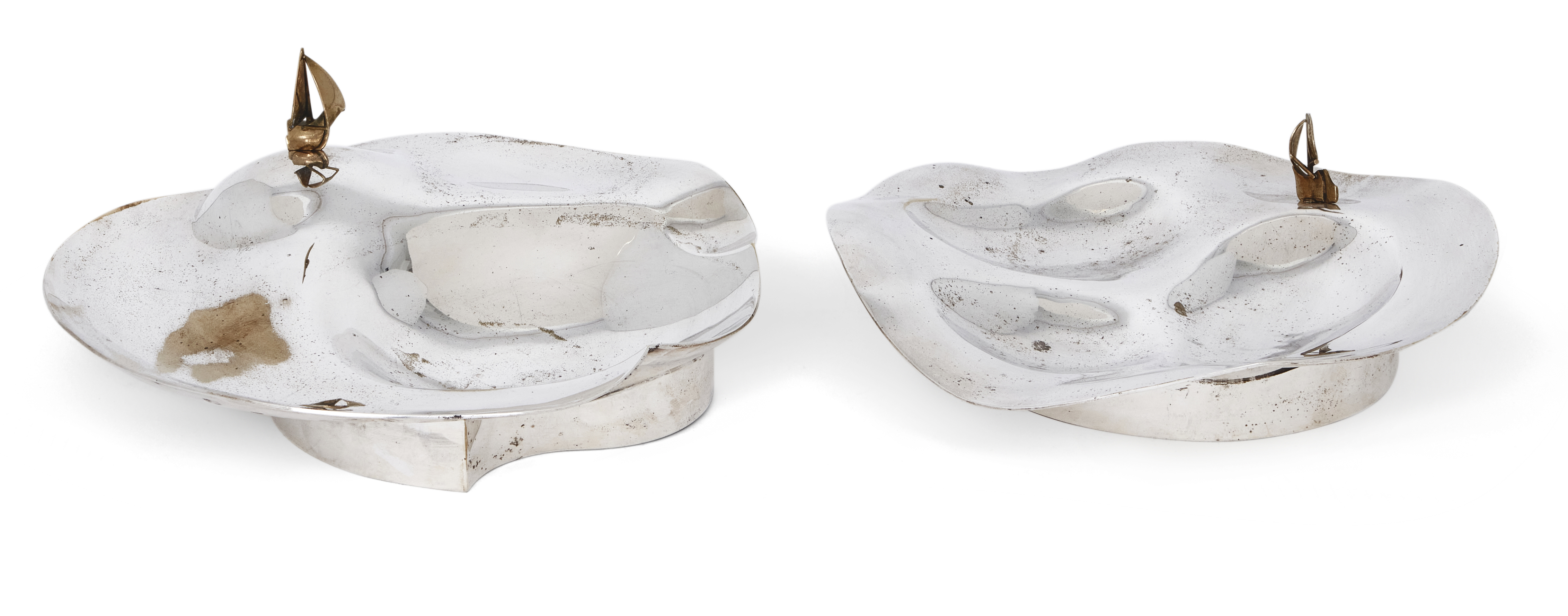 Two silver plated dishes by Rolf Karlsson, c.1980, designed with applied stylised ship motifs, ea...