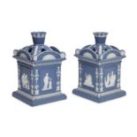 A pair of George III blue jasperware flower vases and covers