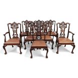 A set of eight George III style mahogany dining chairs