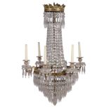 A Victorian gilt-bronze and cut glass six-light chandelier, late 19th century, hung overall with ...