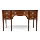 A George III mahogany serpentine fronted sideboard