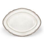A George III silver platter, London,1775, Andrew Fogelberg, of shaped, oval form with gadrooned b...