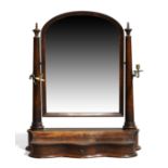 A large Victorian mahogany serpentine fronted dressing table mirror, c.1870, the rectangular mirr...