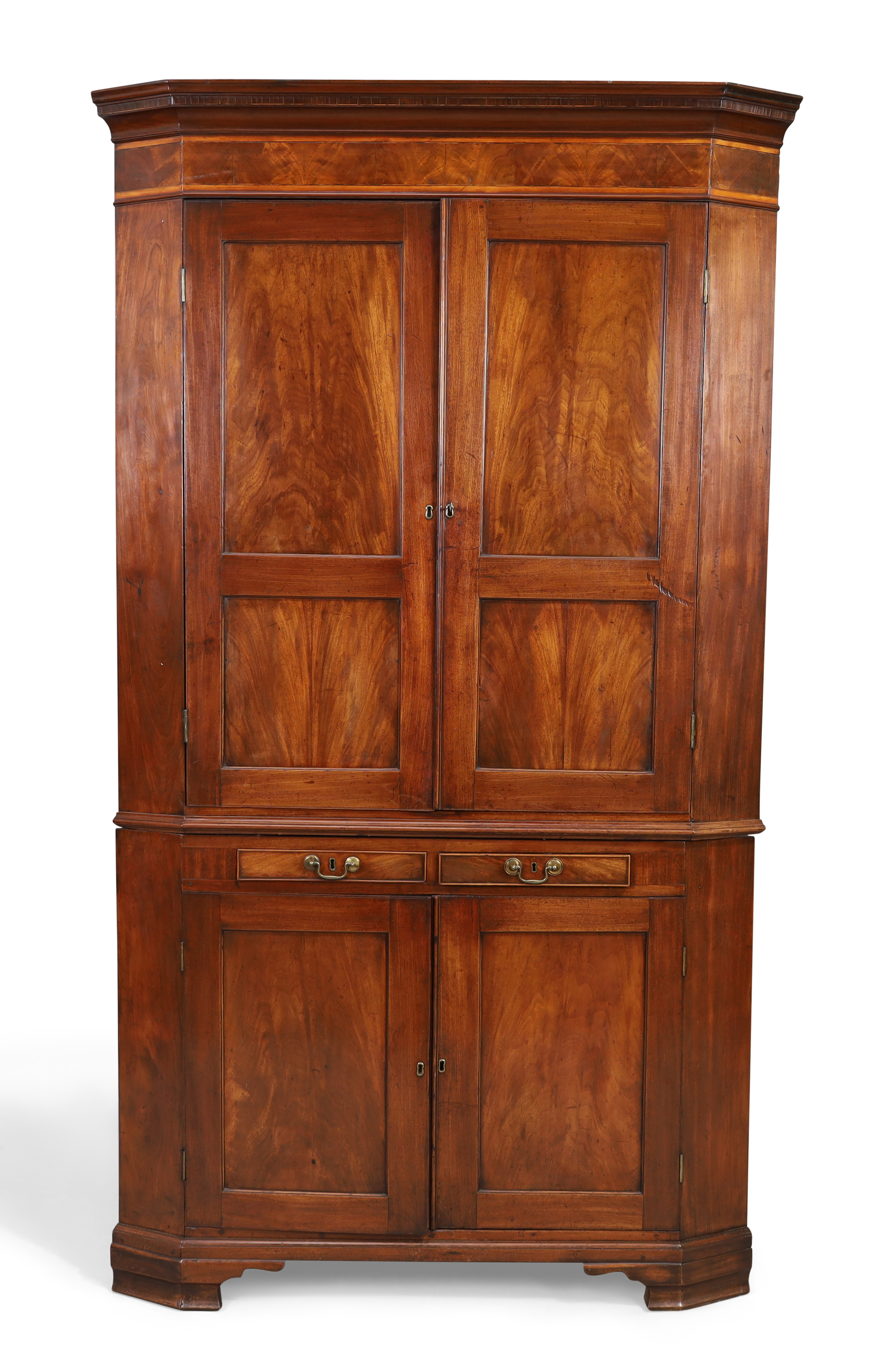 A George III mahogany standing corner cupboard