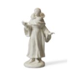 An English porcelain white figure of a monk, c.1755, probably Bow, modelled standing on a mound b...