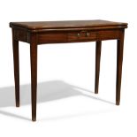 A George III mahogany serpentine tea table