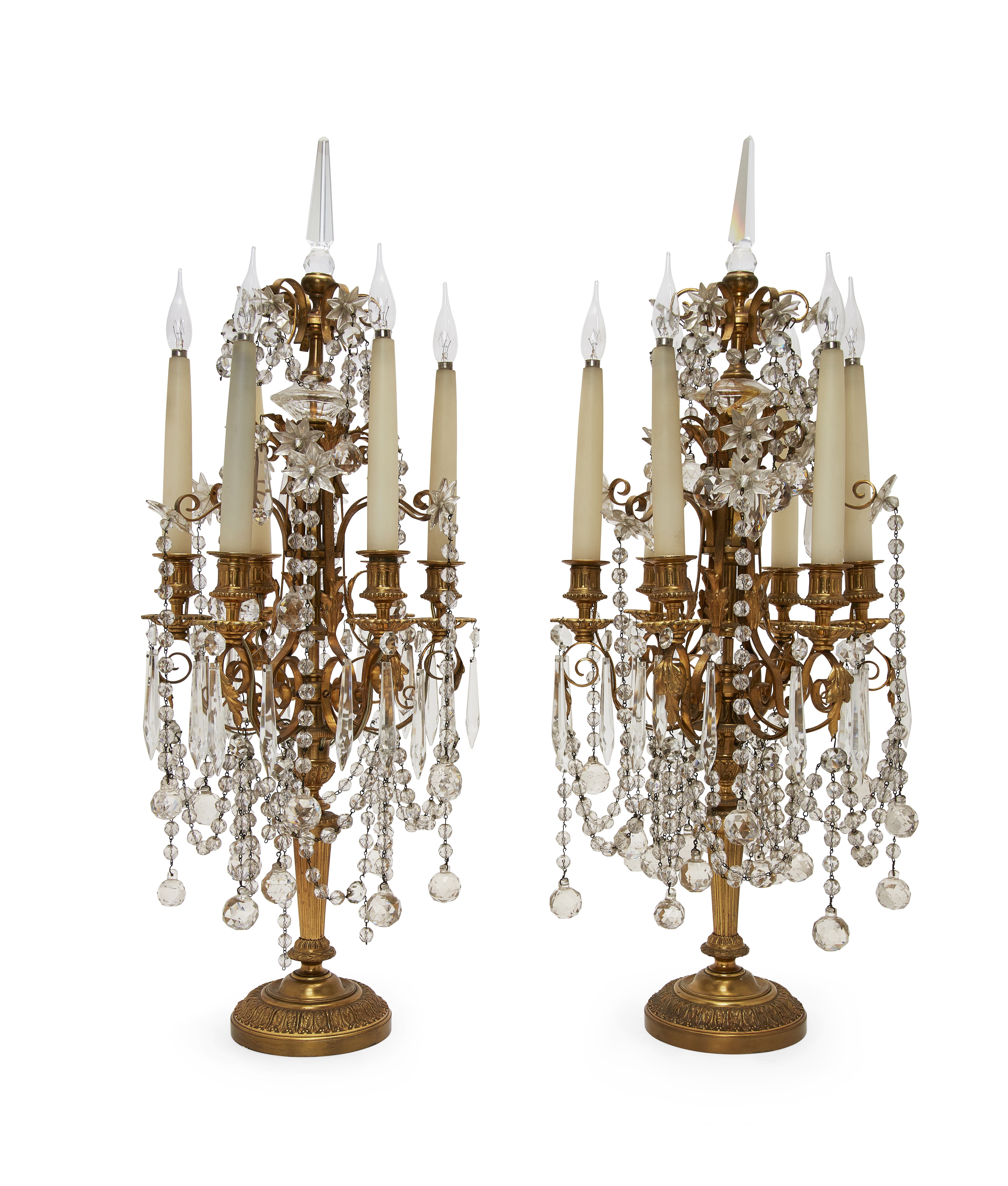 A pair of French gilt-bronze and cut glass six-light candelabra, late 19th century, each with scr...