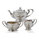 Elkington & Co Art Nouveau batchelors tea service of teapot, cream and sugar, 1901 Silver, ivory...